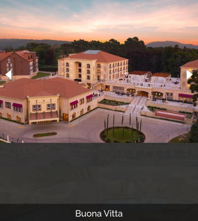 Buona Vitta Gramado Resort & Spa By Gramado Parks Kültér fotó The image shows a large, modern building complex, likely a hotel or resort. The architecture features a combination of traditional and contemporary design elements. Surrounding the main building are landscaped areas, including trees and green spaces,